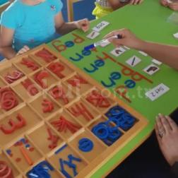 Mrs. Maina was working Montessori Literacy with children using the Montessori Movable Alphabet.